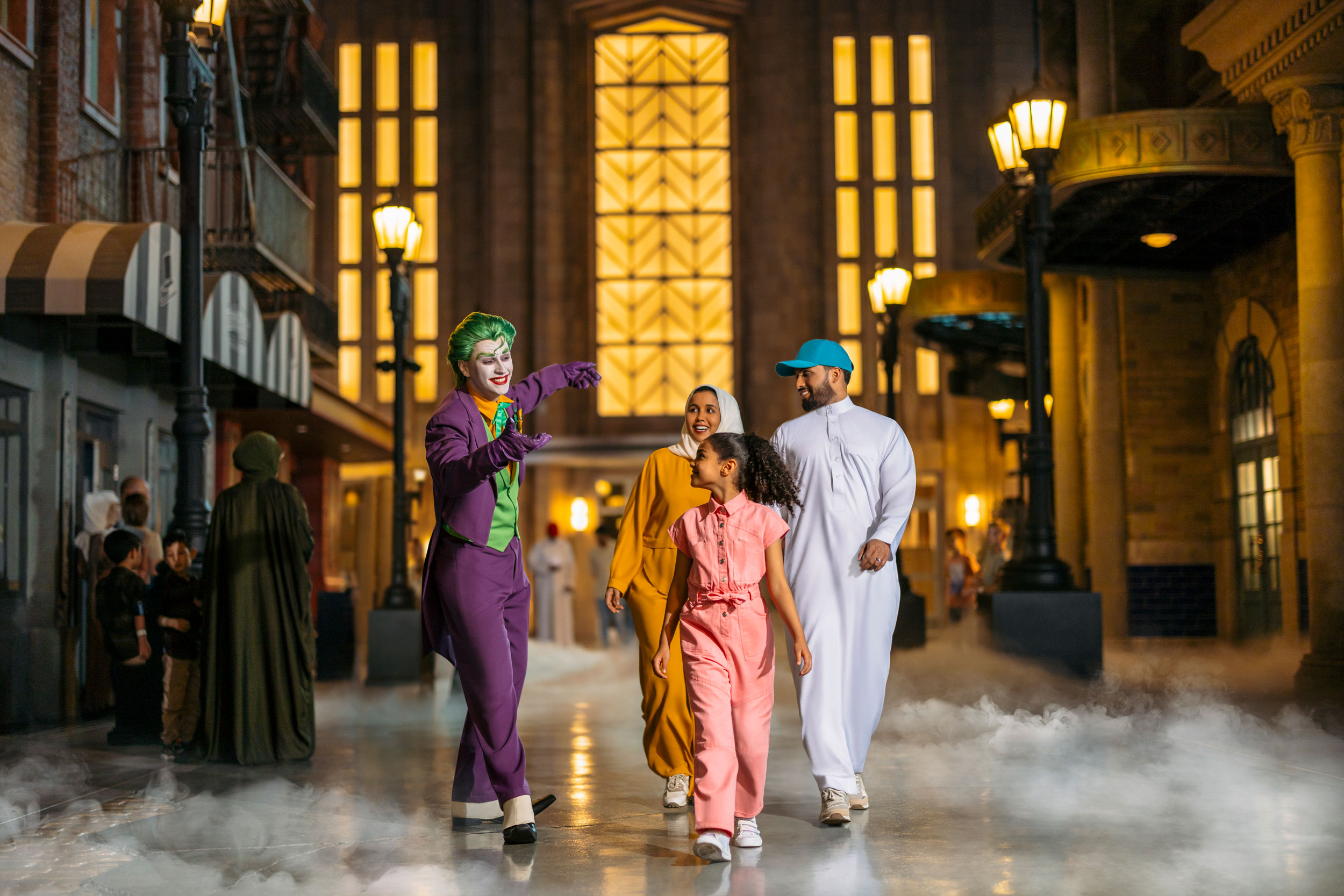 Family meeting the Joker character at Warner Bros. World indoor theme park in Abu Dhabi.